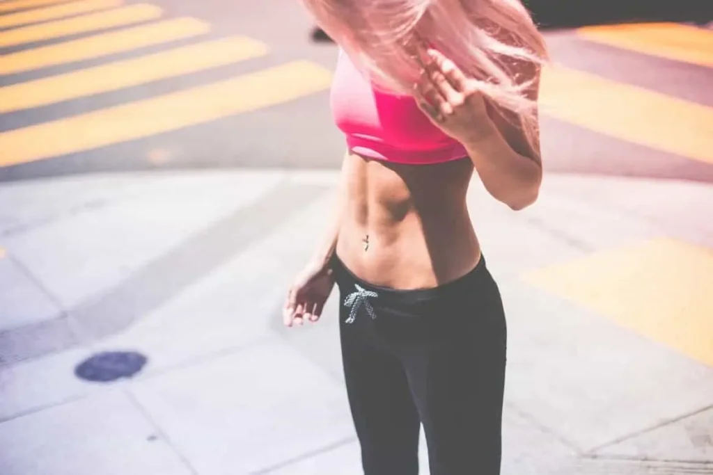 Woman with toned stomach after LA-EMS Body Sculpting Treatment Notting Hill